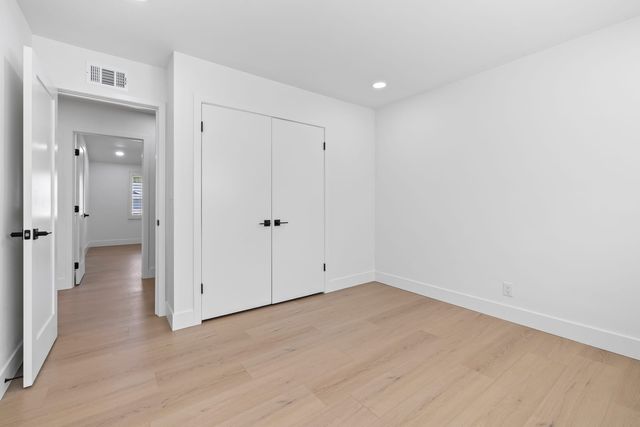 Empty bedroom and hallway doors in a Claremont ranch house, as an appraiser sees them on inspection day